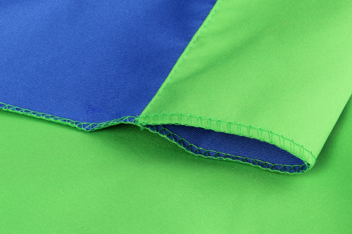 Zware kwaliteit achtergrond doek voor studiofotografie. Tweezijdig: blauw en groen.